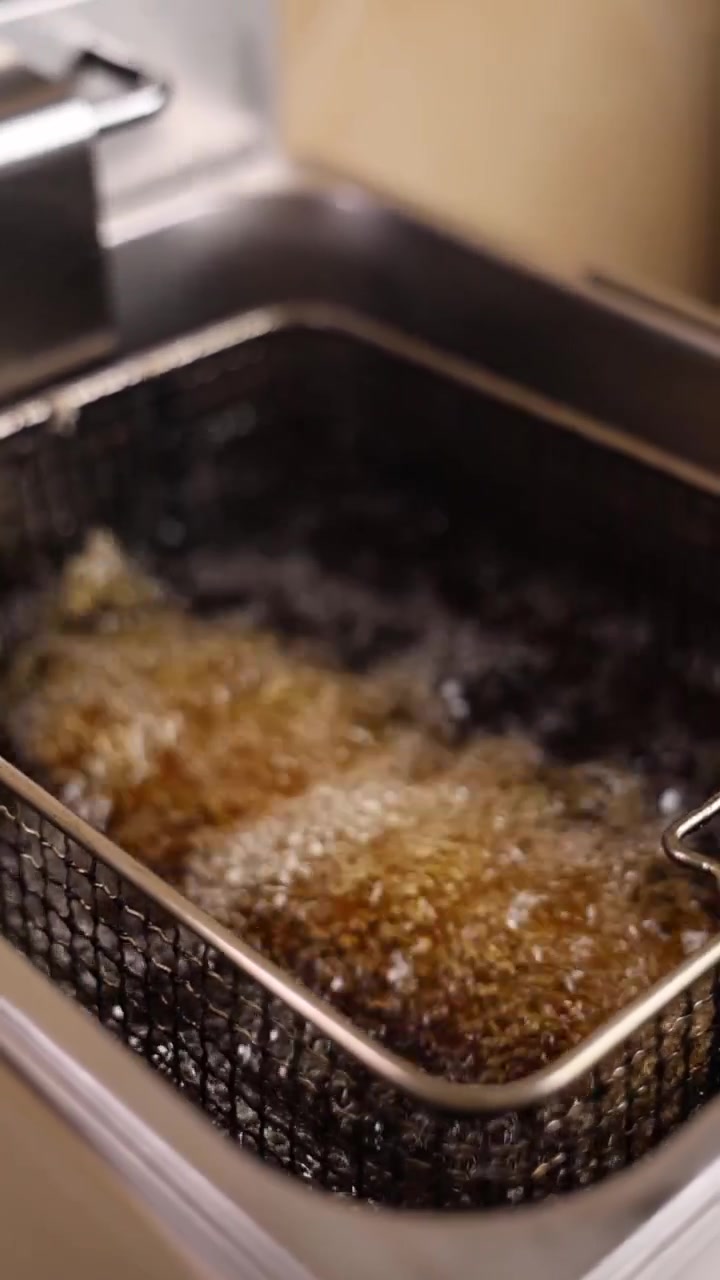 Golden Brown Food Frying in Hot Oil in a Deep Fryer