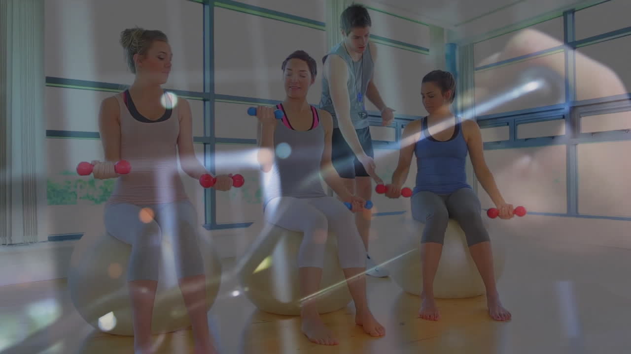 fitness instructor guiding women clients on stability balls, with animated dumbbell and heart icons