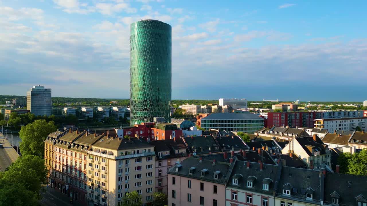 4K Aerial Drone Video of the Modern Westhafen Tower on the Banks fo the Main River in Downtown Frankfurt, Germany