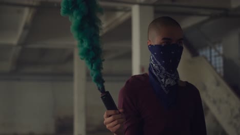 fashionable young man in an abandoned warehouse