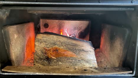 Dry-log-burning-inside-fireplace;-static-slow-motion