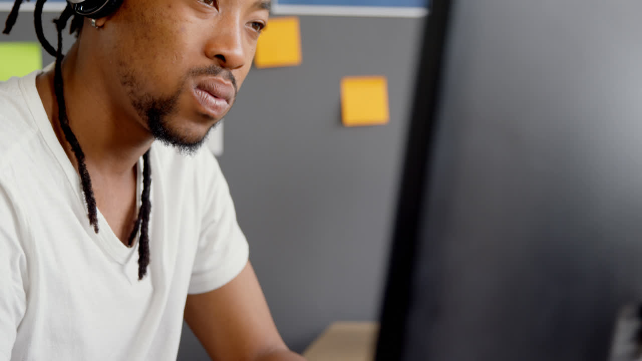 Attentive male executive working on computer in office 4k