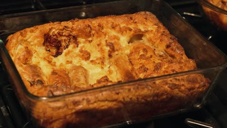 wide view of british toad in the hole in clear dish