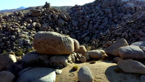 rising drone shot of the large rocks in boulder gardens, california