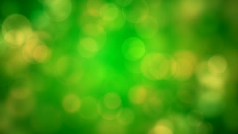 luces brillantes verdes y amarillas en movimiento, reflejos de luz desenfocados fondo bokeh en bucle