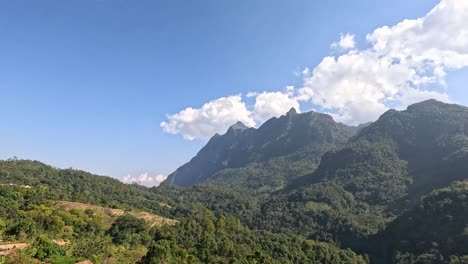 a time-lapse of clouds over a mountain range.