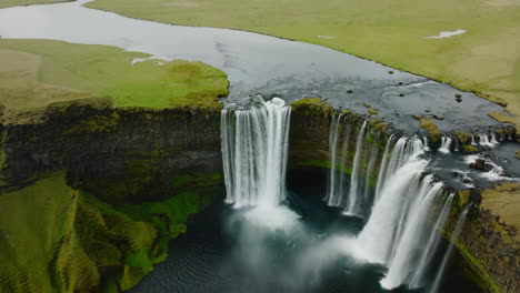 majestic waterfall cascading through lush green landscape