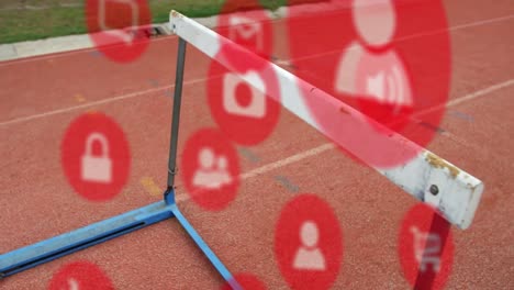 Animation-of-multiple-icons-over-close-up-of-hurdle-on-race-track-in-background