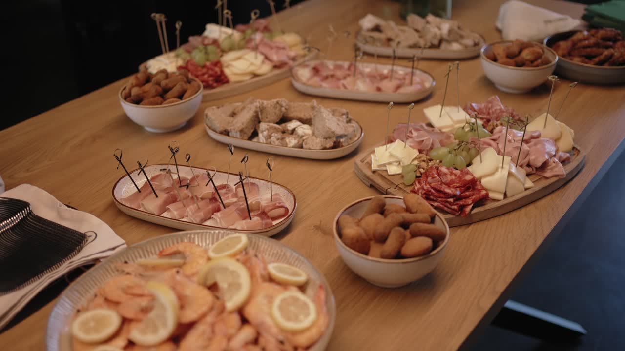 Delicious assorted appetizers spread on warm rustic table