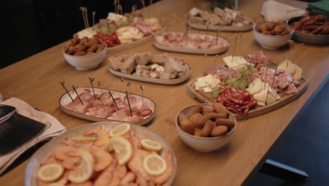 delicious assorted appetizers spread on warm rustic table