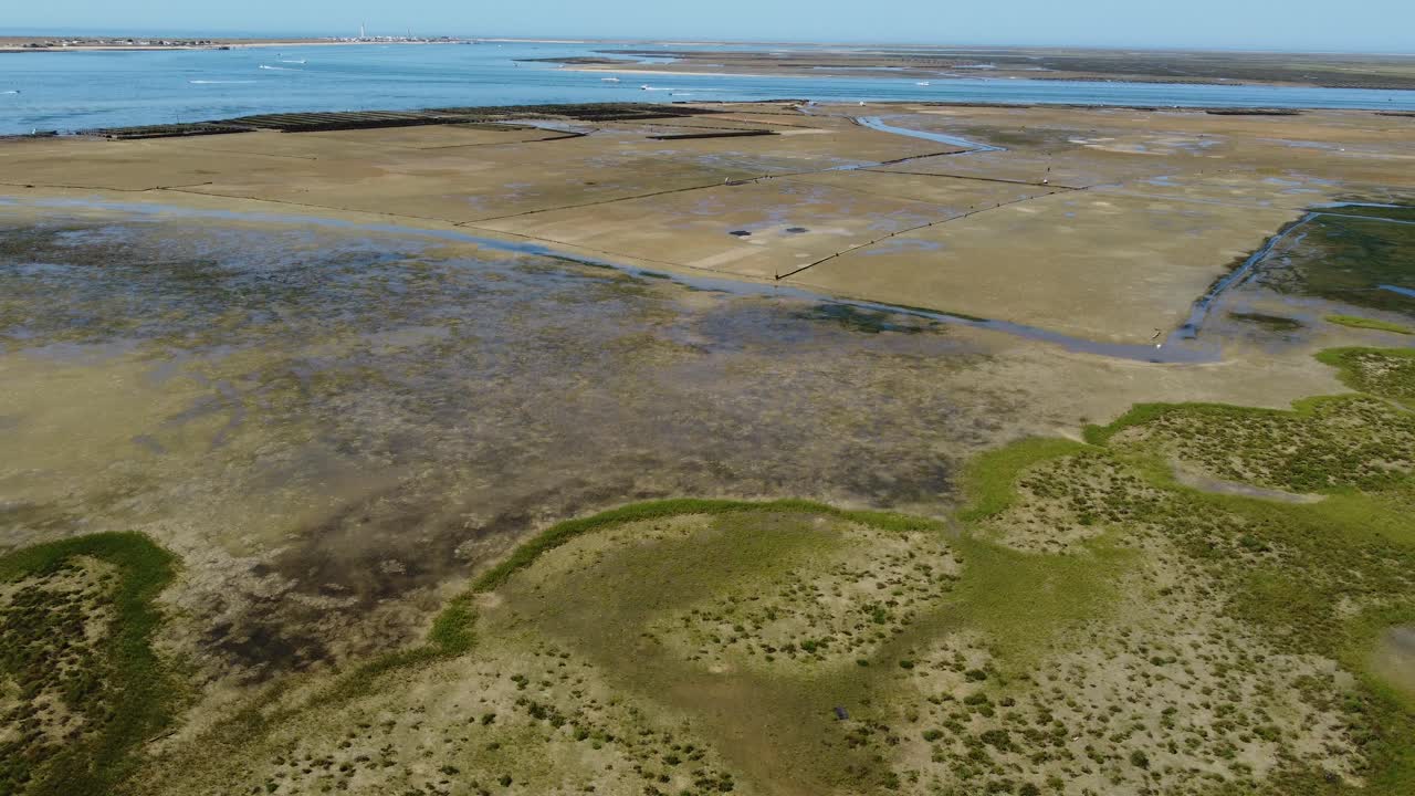 Ria Formosa with riverbed exposed at low tide in Algarve, Portugal