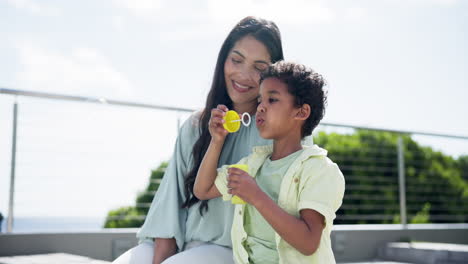 outdoor, mother and kid blowing bubbles