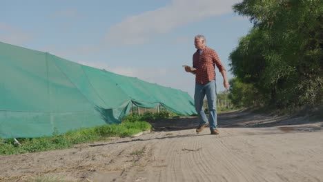 Mature-man-working-on-farm