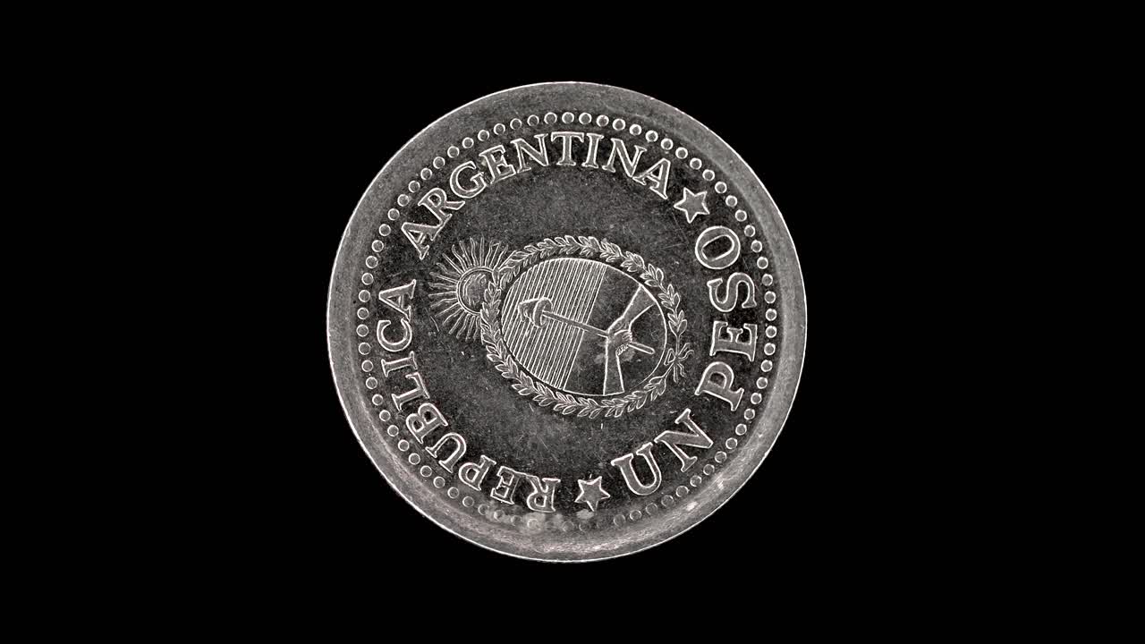 Argentina 1960 1 peso coin obverse with national coat of arms and denomination rotating on black background