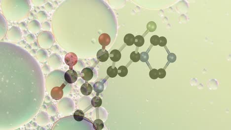 animation of chemical model over bubbles on green background