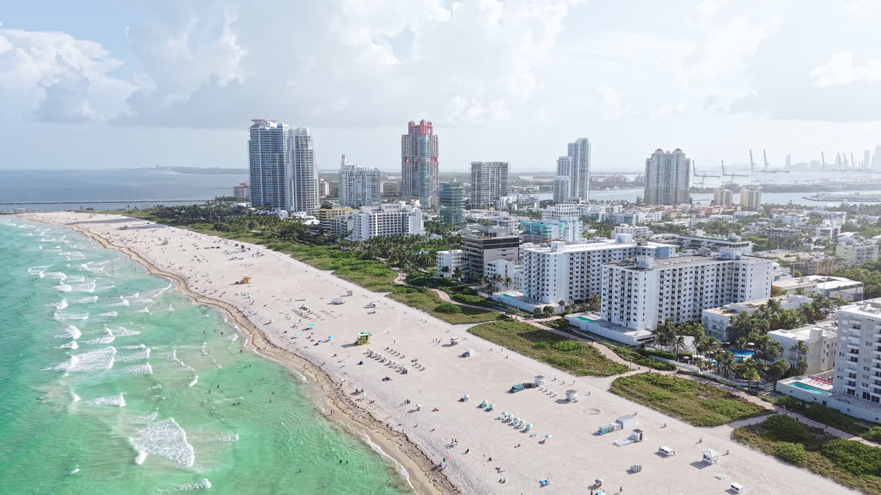 Aerial View of Miami South Beach, Florida USA, Beachfront Buildings and Turquoise Sea, Establishing Drone Shot