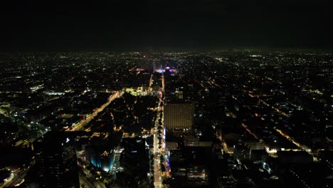 drone-shot-of-fireworks-demonstration-at-mexico-city-zocalo-and-juarez-avenue-during-independence-day-celebration