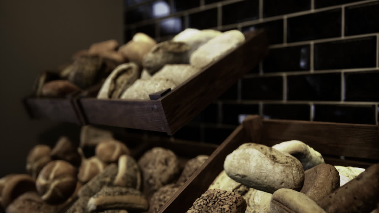 Artisan bread displayed on wooden racks in a cozy bakery environment