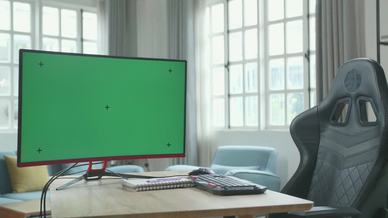 Green Screen Desktop Computer On A Table With A Chair In The Working Room At Home.