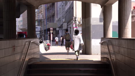 hongkong- may 20, 2022: daily working of peoples. hong kong never sleeps with busy streets and a bustling population. motion walking citizens through the stairs of the subway. busy scene of workers.