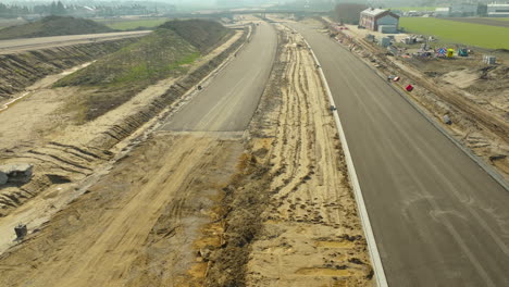 aerial view of a road under construction with exposed soil