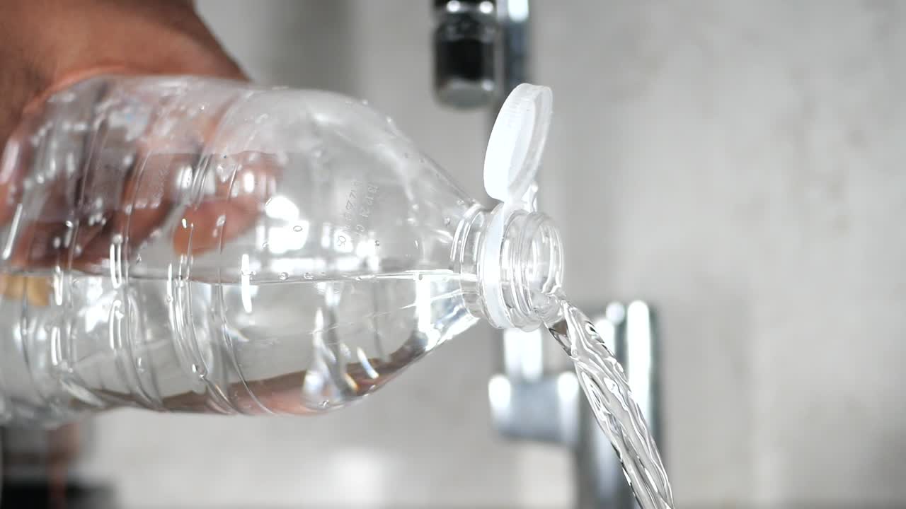 Filling a Water Bottle from a Tap