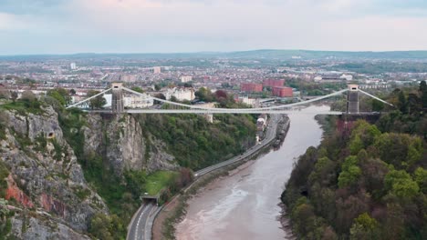 dolly forward drone shot over the clifton suspension bridge towards central bristol