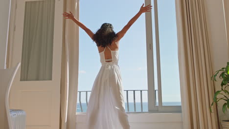 travel-woman-dancing-in-hotel-room-having-fun-celebrating-summer-vacation-enjoying-carefree-holiday-lifestyle