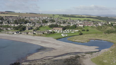 an aerial view of inverbervie looking over the town from the sea on a sunny summer's day