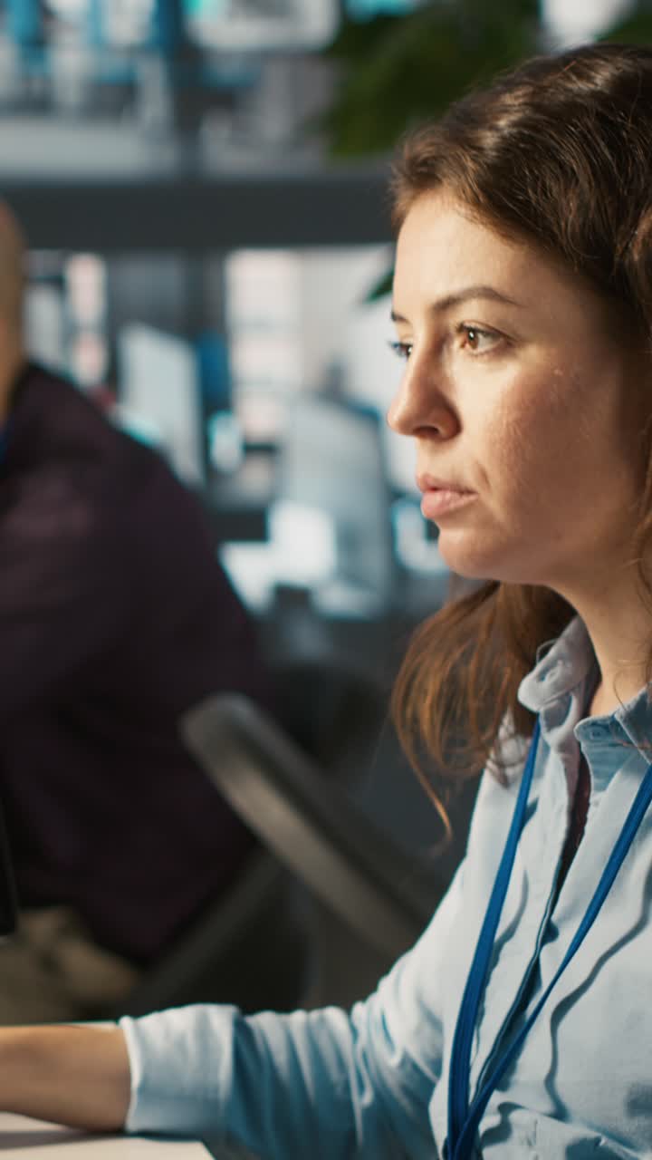 Vertical video Office clerk at computer desk reading documentation files, solving tasks