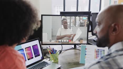 african american business people on video call with african american female colleague on screen