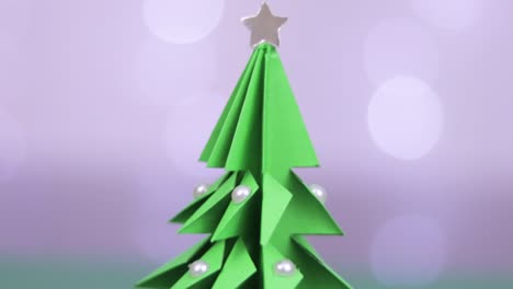 origami christmas tree decorated with pearls. tilt