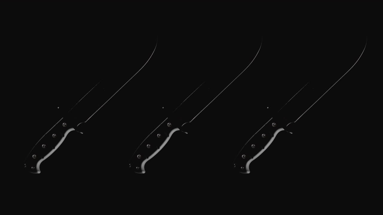 Knives on the dark background rotate in slowmotion