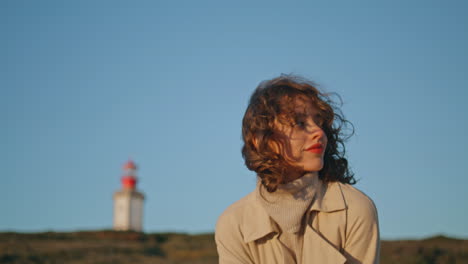 Travel-girl-posing-green-hill-vertically-shot.-Calm-curly-woman-resting-sunlight