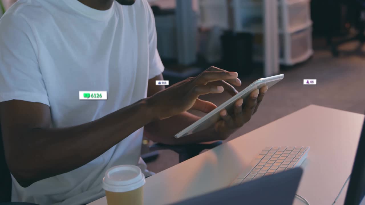 Man holding tablet at desk, monitoring social media metrics overlay in marketing scene