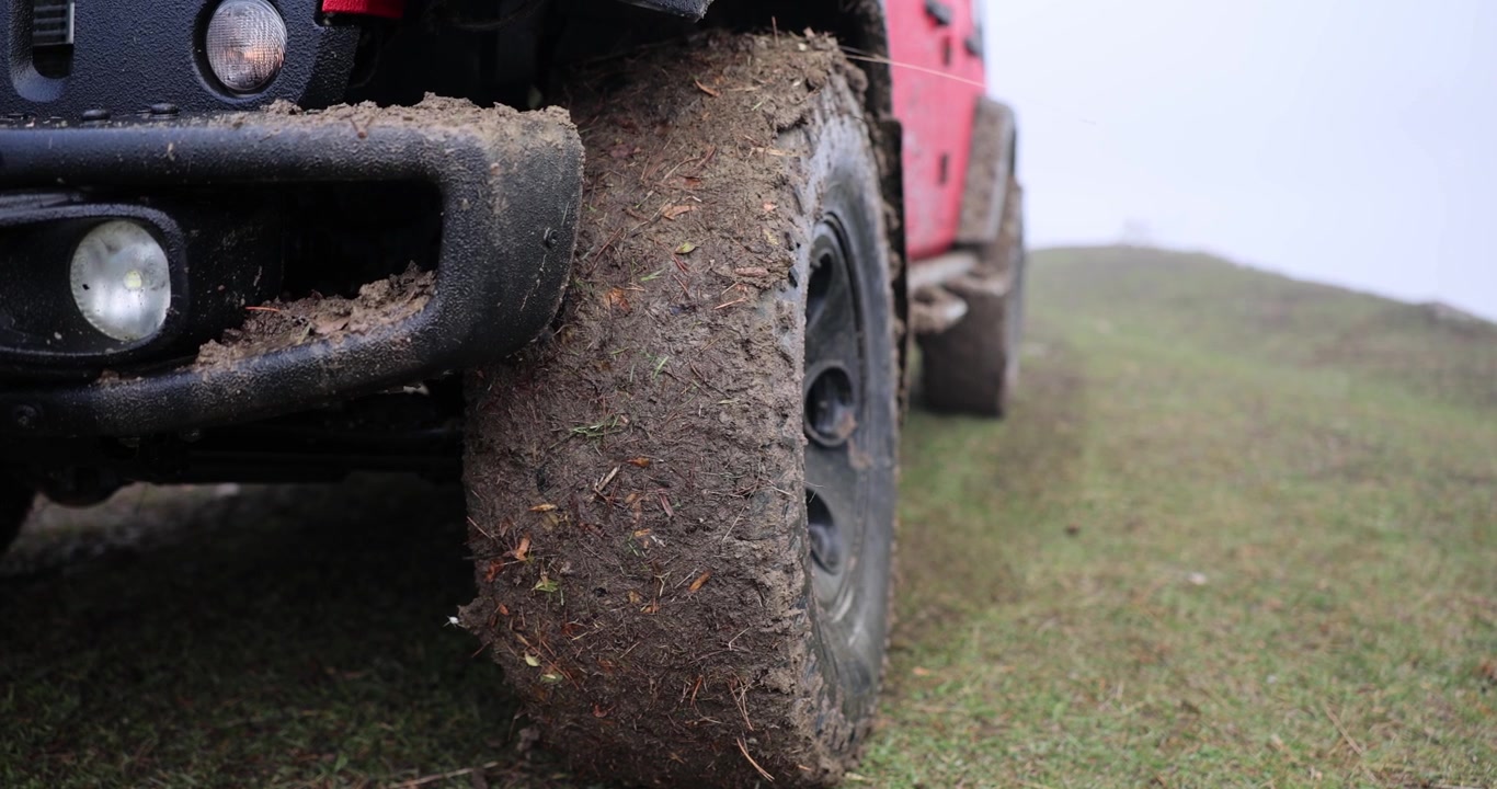 Exploring muddy trails in a rugged landscape with a powerful offroad vehicle
