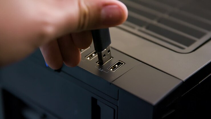 Man Plugs Cable into USB 3