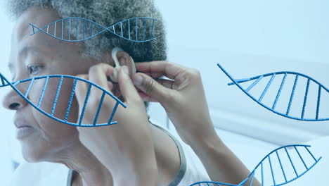 animation of dna strands over diverse female doctor and patient in hospital