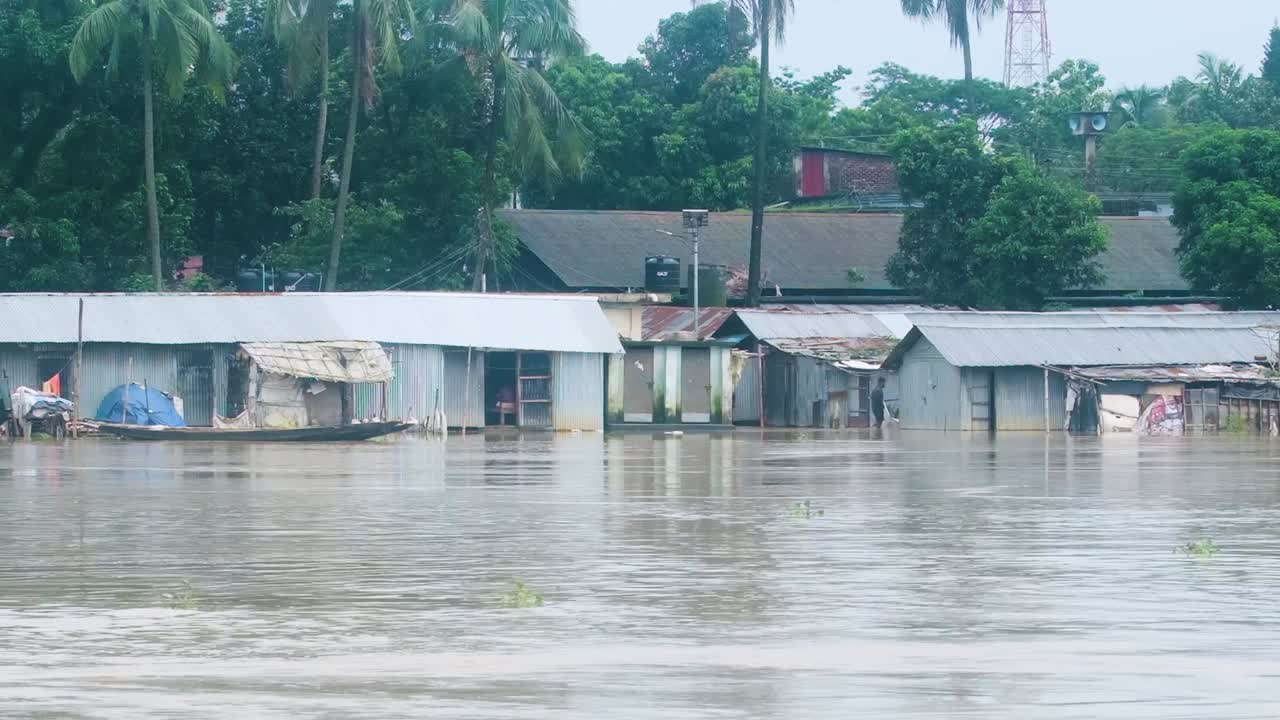 Flooded river Bangladesh slum, home underwater Monsoon season South Asia