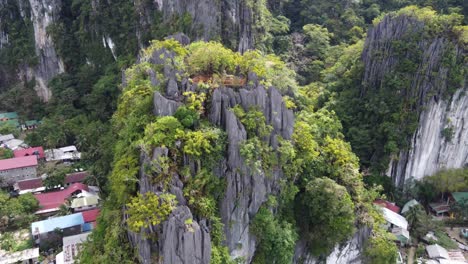 canopy walk and dream catcher viewpoint, also called taraw cliff on top of lush tropical jagged rock formation in el nido town