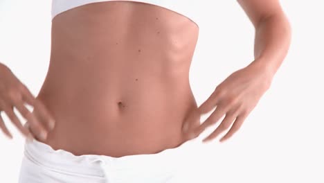 close up of the belly of a hispanic woman posing in front of the camera