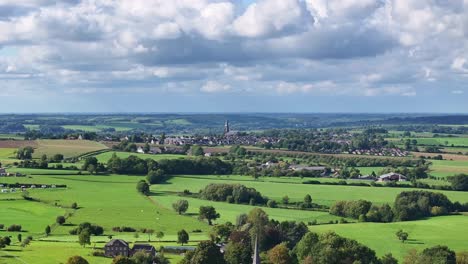 church spire of vijlen on the horizon, aerial reveal of holset village