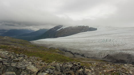 clouds passing over glacier in alaska