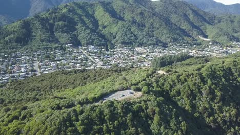 Drone-view-of-a-boat-in-Picton,-New-Zealand