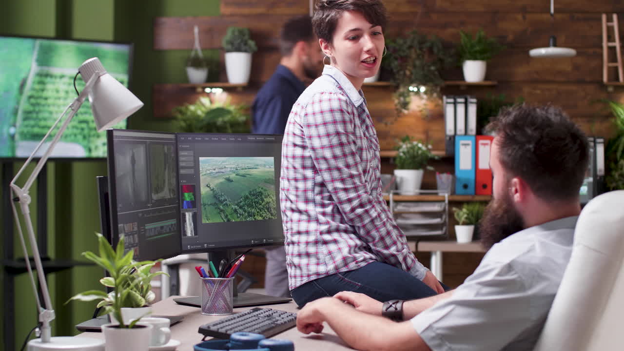 People in office editing videos