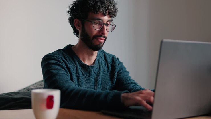 Gay or young man Working From Home on Laptop