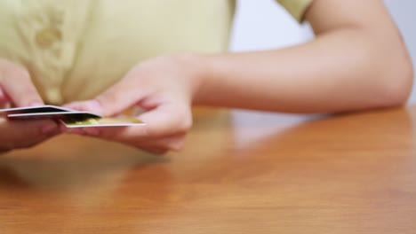 A detailed examination of credit card choices a financial setting highlighting hands selecting cards