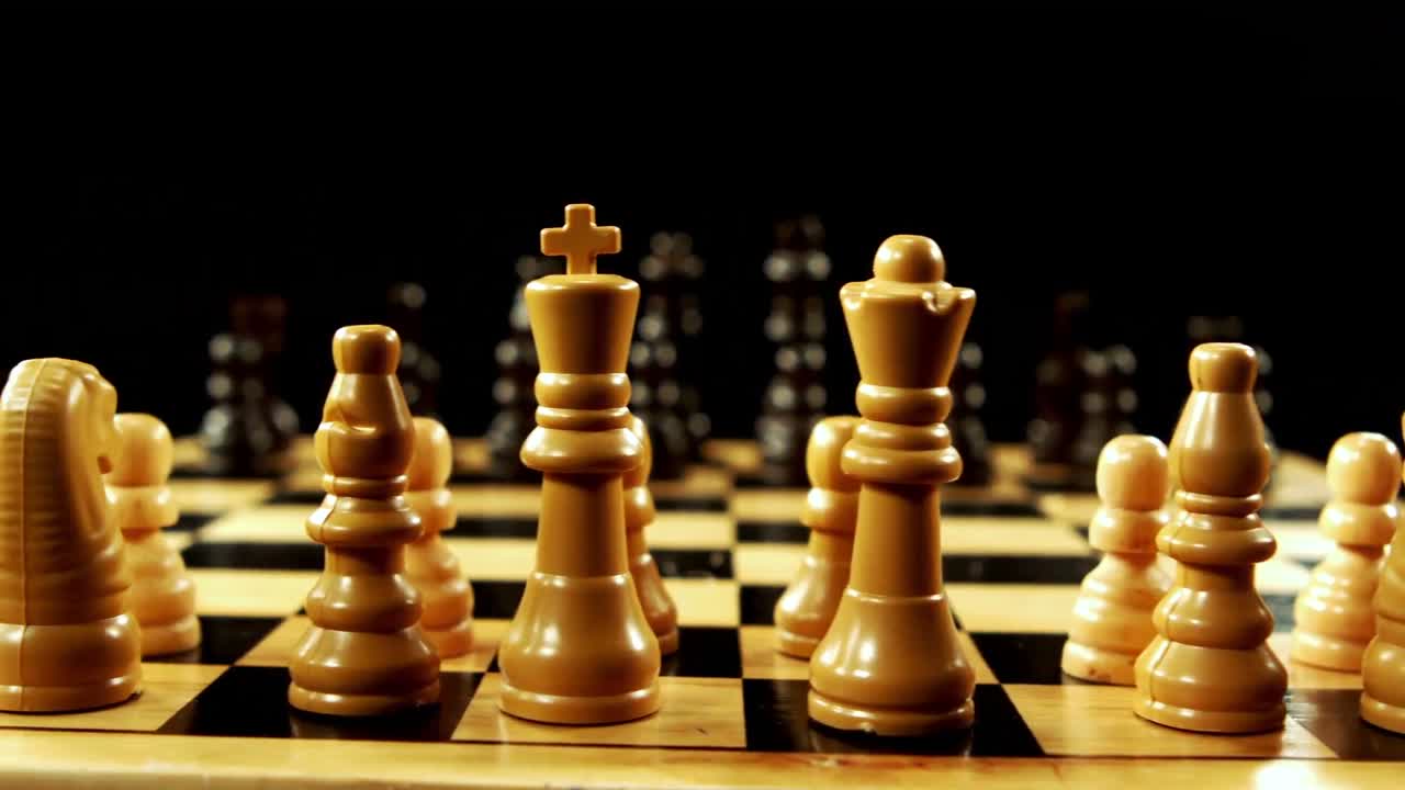 Chess set against black background
