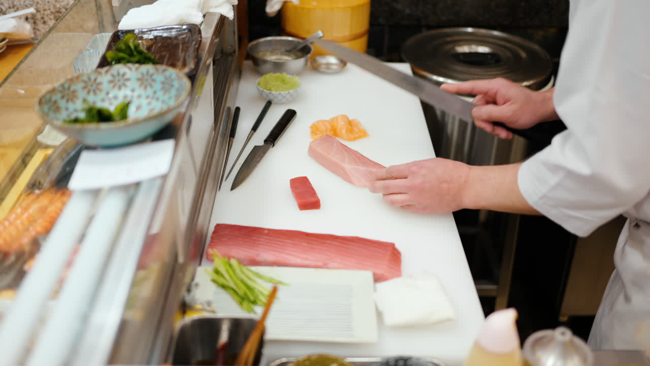 Close up of a chef cutting fish at the Tsukiji Fish Market in Japan
