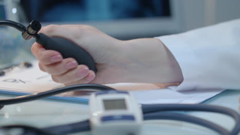 measure blood pressure. blood pressure check. nurse hand measuring pressure